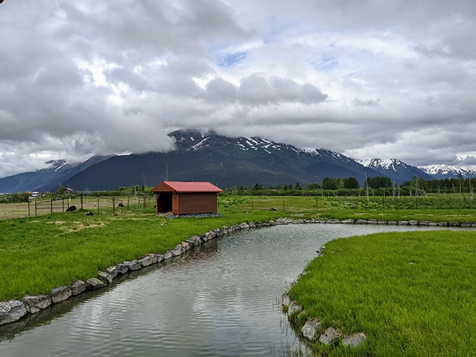 Red Barn Against the Mountains