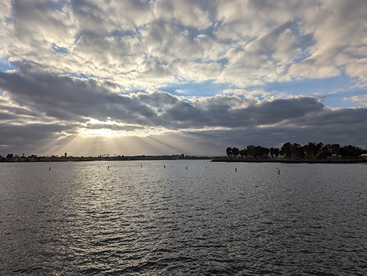 Sunbeams striking San Diego Bay