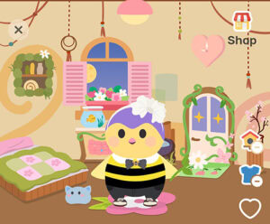 A cartoonish yellow bird with a purple head and a black-and yellow outfit is in her room, which is largely decorated in pink, green, and brown